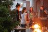 03/73/15 - Kristen Witham, senior art major, roasts marshmallows with her sisters during Residence Life's Sibling Weekend event on the Bowld Commons patio.