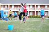 04/117/15 - Students transport a water balloon between their backs to a bucket during Field Day outside the Bowld Student Commons.