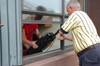 08/28/04 - A couple of parents help their student move into a dorm room during Freshmen Move-In.