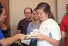09/251/15 - Nikki Morris, freshman biology major, receives her snack from resident advisor Brooke Bates, junior psychology major, during Progressive Snacking, a resident life event.
