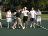 President David S. Dockery greets his teammates at the Faculty/Staff vs. Student basketball game at the dedication of the Class of 2002 Basketball Court.  Team members pictured include from left to right: Katie Woodruff, Tonya Tuggles, Dr. Paul Jackson, Bobby Ludwig, & Jay Ridenour. - Photo by Cam Tracy
