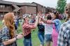 09/272/15 - Covered in fake tattoos, residence adviser Erin Slater high-fives students after a victory in the annual DF Olympics on the Heritage Complex lawn.