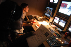 11/2/2004 - Senior broadcasting major April Houston directs Union's first live broadcasts of the basketball games.  Her husband Adam does graphics in the background. (ID: 2618)