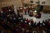 11/334/15 - Students gather in the McAfee Commons to hear the Christmas story read by Dub Oliver, university president. It is a tradition that has been around for years.