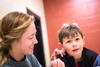 03/65/16 - Brittney Schlatter, Resident Advisor and junior nursing major, paints faces during the Residence Life Grill Out event for Sibling Weekend.