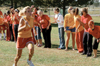 Junior Blaire Collins, nursing major, races
for the finish line as her XO sisters line the track to cheer her on. - Photo by Kristen Hiller