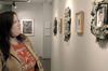 Rachel Evans Morris takes in the faculty art work that was on display in the art gallery during the month of November. - Photo by Lindsay Stavish