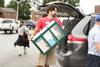 08/232/16 - Scott Heit, assistant vice president for university communications, helps unload a vehicle for a new student moving in.