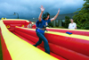 09/14/02 - Christen Tucker, sophomore Christian Studies major, has fun with the bungee cord at Fall Fest 2002.