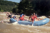 Laura Hicks, Eunice Sung, Derek Wood and Bambi Chao enjoy the Ocoee rafting trip as their guide steers them into safer waters. The trip provided an opportunity for studentsto get away from campus and jump into an adventure. - Photo by Jonathan Blair