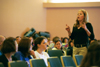 Lauren Webb, junior pre-pharmacy major, passionately details her experiences with GO trips at the GO Week Chapel Service 2002. - Photo by Justin Veneman