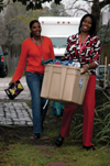 Seniors Autumn Smith and Lartyania Merriweather Hammick deliver supplies to the Care Center as a part of a Student Association of Social Workers project. - Photo by Amanda Herron