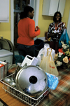 Seniors Autumn Smith and Lartyania Merriweather Hammick deliver supplies to the Care Center as a part of a Student Association of Social Workers project. - Photo by Amanda Herron