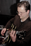 Christian studies professor Greg Thornbury played some blues with English professor Gavin Richardson during a show at Jason's Deli. - Photo by Amanda Herron