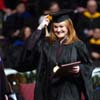 12/18/04 - An excited Laura Bush, marketing graduate from Jackson, moved her tassle after receiving her diploma at fall graduation.