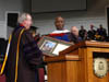 12/18/04 - President Dockery presented Barry Black with an honorary doctor of divinity degree during the fall graduation ceremony.