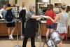 05/134/18 - Tina Netland, administrative assistant, hands out plates during Food for Finals.