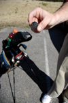 03/5/05 - Senior Jason Johnson holds his marking device for his golf ball, given to him by his church for starting the youth program.