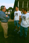 Freshmen Dan Dresselhaus and Josh Brubaker chat with Dr. David S. Dockery at the Ice Cream Social at Dr. Dockery's house during New Student Orientation 2002. - Photo by Kristen Hiller