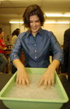 11/16/04 - Senior Melanie Rickett soaks paper pulp in the next step of the paper making process.