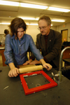 11/16/04 - Senior Melanie Rickett rolls the paper pulp in the next step of the paper making process, as chemistry professor Jimmy Davis helps.