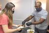 09/259/20 - Kevin Morgan, assistant residence director, serves his chocolate-covered chips during Res Life's Progressive Snacking.