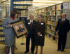 Provost Carla Sanderson presents Bob (’48) and Mary Ruth ('56) Hundley a photo of The Hundley Center for Academic Enrichment during a Homecoming dedication ceremony. - Photo by Morris Abernathy