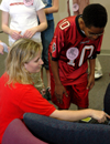 02/23/05 - Senior Stacey Chandler interacts with a junior high school student during a Students in Free Enterprise (SIFE) project.