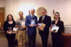 Phi Alpha Theta presidents (past - Spencer Lowery, left of center; present - Heather Tobe, far right; future - Cassie Harris, far left), along with Chapter Advisor Stephen Carls (center) and Library Director Steve Baker, hold history books purchased with prize money that Union's chapter won in a national organization's 2004 Best Chapter Award competition. A check was presented to the library that same day. - Photo by Morris Abernathy