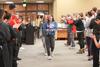 12/340/21 - Faculty and staff cheer as students arrive at the first Food for Finals event in the cafeteria.