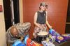 03/87/22 - Kevin Morgan, residence director for the men's quads, and Miley Sparks, residence advisor, help feed students at ResLife's annual Progressive Snacking event.