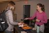 03/87/22 - Jessa Kliewer, residence director, helps feed students at ResLife's annual Progressive Snacking event.