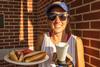 09/248/22 - Student Rachel Vanpelt posing with her meal at ResLife's Block Party cookout for Labor Day.
