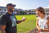 09/248/22 - Residence director Kevin Morgan laughs with Mikie Veneable during the ResLife's Labor Day Block Party.
