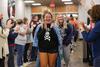 12/346/22 - Student Rachel Mitchell is greeted by faculty and staff members cheering on students during the bi-annual Food for Finals event.
