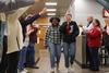 12/346/22 - Students Brittany Simpson and Jessica Searl are greeted by faculty and staff members cheering on students during the bi-annual Food for Finals event.