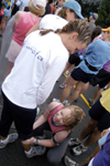 Seniors Jade Barnard and Devin Kielhorn help each other get ready for the Country Music Marathon. - Photo by Jonathan Blair