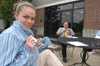 Sophomore Julie Palmer, theatre/speech major, prepares to participate in the Symposium with her creative writing class. The class read original works aloud outside the SUB. - Photo by Kristen Nicole Sayres