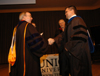 05/4/05 - President Dockery congratulates mathematics professor Chris Hail after he was named Faculty of the Year during Awards Day.