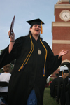 5/21/05 - Pychology and sociology graduate Alisha Reeves celebrates after receiving her degree at spring graduation.  Alisha is the first member of her family to graduate from college.  - Kyle Kurlick