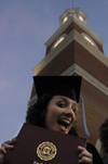 Broacasting graduate Ashley Mitchell shows off her diploma shortly after the spring graduation ceremony. - Photo by Kathleen Murray
