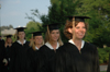 05/21/05 - Business graduates Lauren Oldham, Holly Ragan, Natalie Reynolds and Jessica Rudy file onto the Great Lawn during spring graduation.