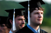 Public relations graduate Ross Kyzar (foreground) and music graduate Chris Lyles (background) look toward the future during spring graduation. - Photo by Kristen Nicole Sayres