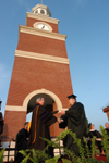 President Dockery presents Matt Oshell with a degree in political science at the spring graduation ceremony. - Photo by Morris Abernathy