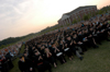 After each of the degrees were conferred, the graduates gave themselves a round of applause. - Photo by Morris Abernathy