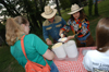 05/19/05 - Keith and Beverly Absher dip out a cool treat for graduating senior Lindsey Barnes during the Happy Trails social at the Dockery's.  Keith is the Dean of the McAfee School of Business Administration and Beverly is the Director of Human Resources at Union.