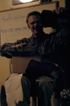 Professional photographer Tom Fox is presented with some Union apparel after giving a lecture on nature photography to photography students. - Photo by Jonathan Blair