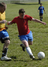 Intramural Soccer Action - Kevin McDaniel covers Brandon Nelms. - Photo by Jonathan Blair
