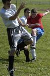 Intramural Soccer Action - Josh Howerton dodges a shot by Brandon Nelms as Ben Hoskins looks on. - Photo by Jonathan Blair