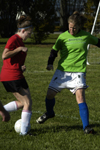 Intramural Soccer Action - Chi Omega Kari Bachman and Sniper Katie Woodruff battle for position. - Photo by Jonathan Blair